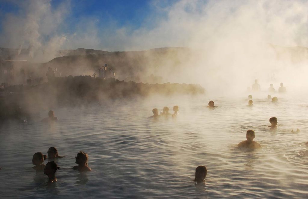 Students enjoying the blue lagoon in Iceland - steaming water
