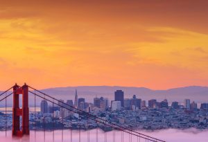 Beautiful sunrise at Golden Gate Bridge in Low Fog