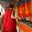 Tibetan Buddhist monk spinning prayer wheels