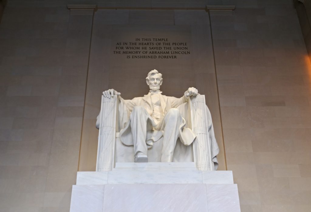 Statue of Abraham Lincoln inside the Lincoln Memorial—essential visit on Washington DC school trips studying civil rights, leadership, and U.S. history.