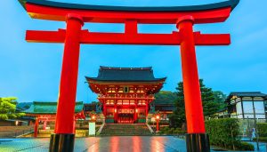 Fushimi Inari Taisha shrine in Kyoto, Japan, featuring iconic red torii gates – an ideal educational visit for students exploring Shinto beliefs and Japanese religious traditions