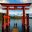 Students exploring the iconic red Torii gate at Lake Ashi in Hakone, Japan, during a cultural school trip focused on Japanese religion and traditions.