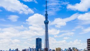 Tokyo Skytree standing tall above the city skyline, offering students panoramic views and insights into Japanese engineering and broadcasting technology during a school trip.