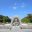 Hiroshima Peace Memorial Park cenotaph with the Atomic Bomb Dome in the background, a key historical site for school history trips to Japan