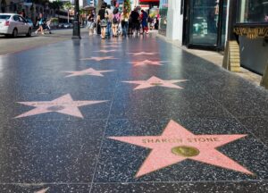 Students walking along the Hollywood Walk of Fame in Los Angeles, viewing stars like Sharon Stone’s—part of a Kipling Tours media studies trip exploring the global influence of the entertainment industry