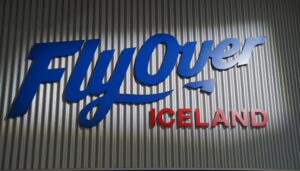 FlyOver Iceland entrance sign, an immersive flight simulation experience popular with students on educational school trips exploring Iceland’s landscapes and culture.